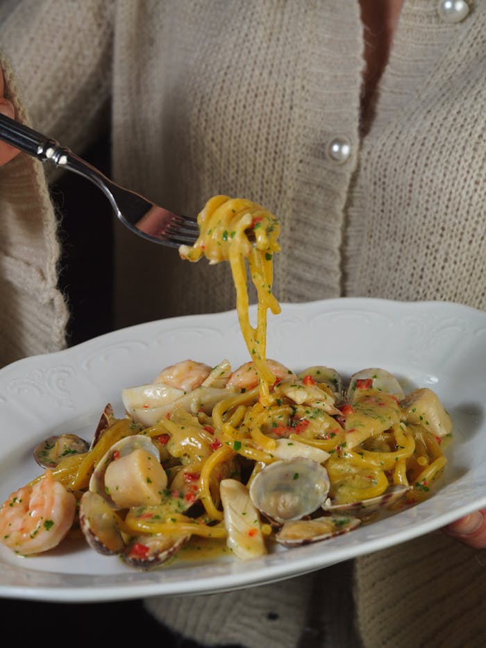 Delicious seafood pasta with clams and shrimp, perfect for a gourmet dinner.